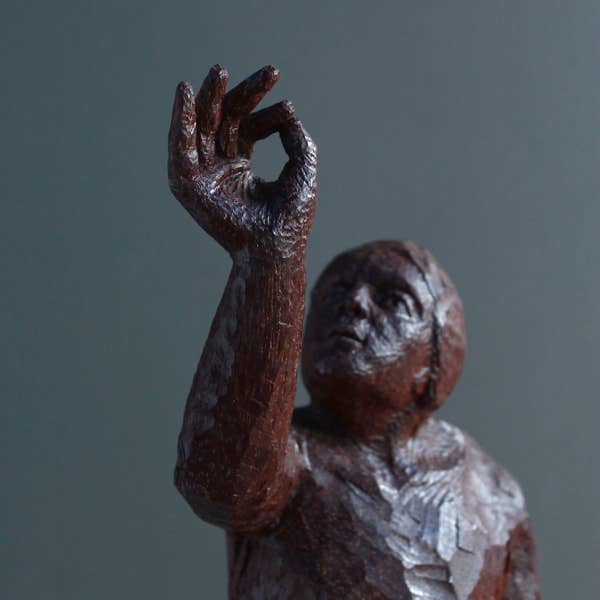 wooden figure sculpture by jamie frost