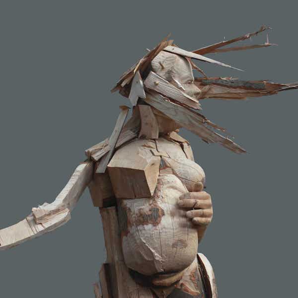 carved wooden figure by jamie frost