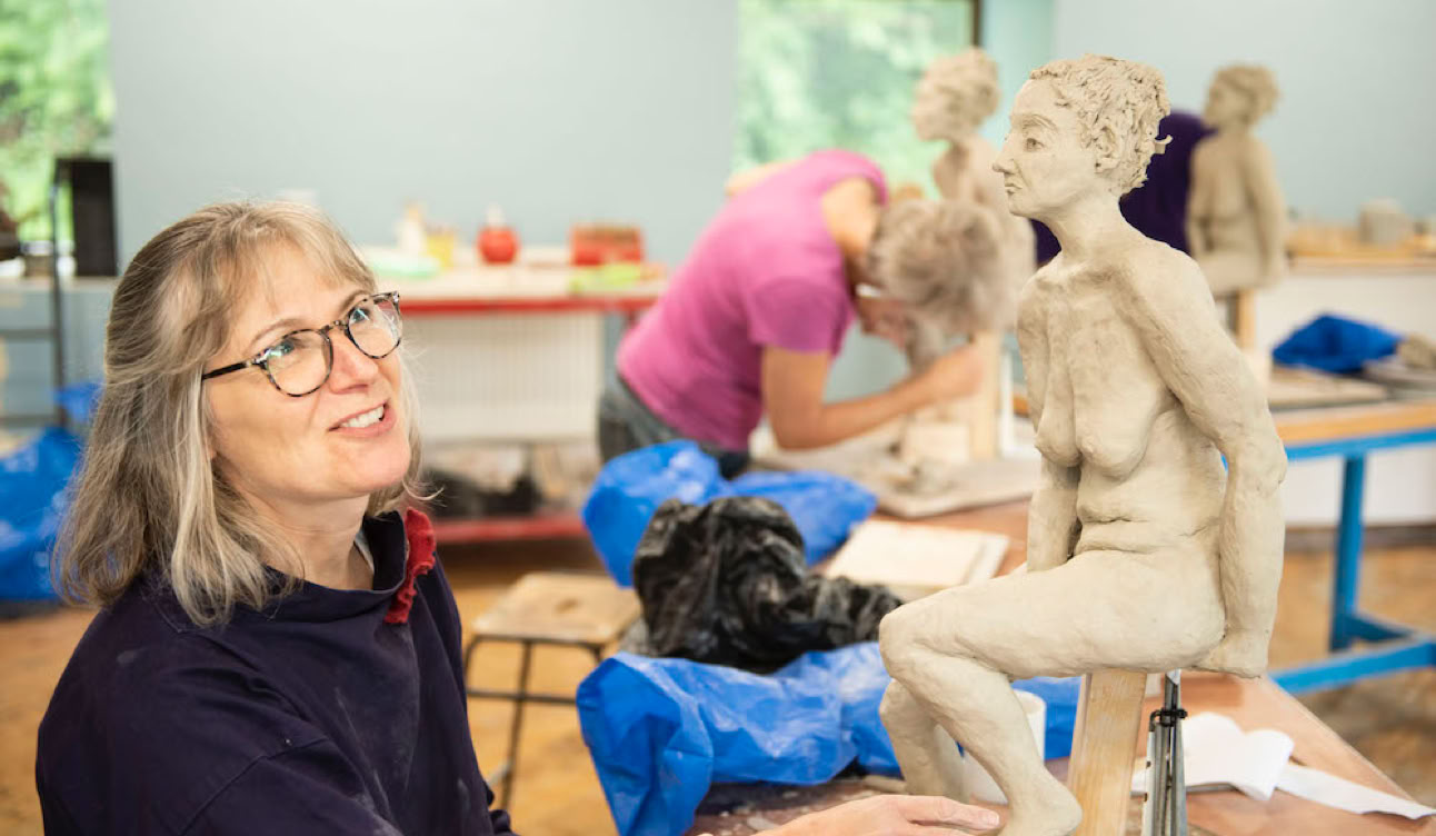 Clay sculpture class in progress at Sculpture Lounge Studio
