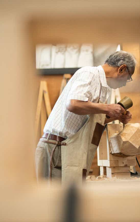 Student carving in jamie Frost's studio.