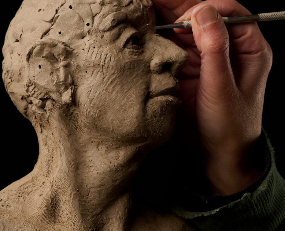 Jamie Frost teaching clay figure sculpture.