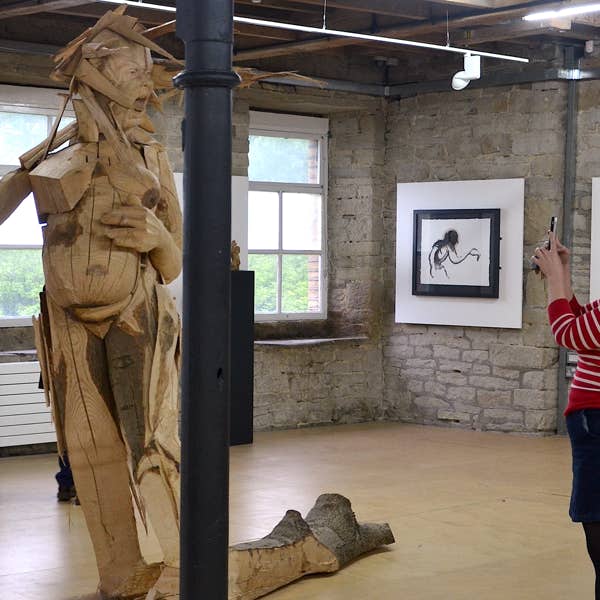 carved wooden figure by jamie frost