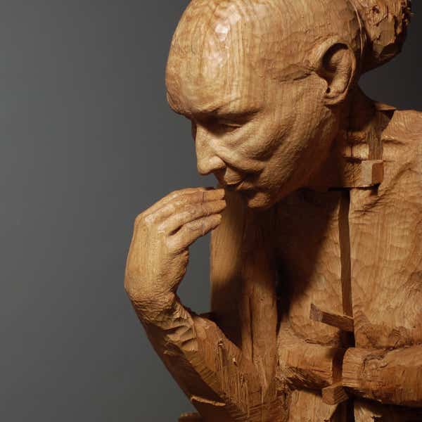 carved wooden figure by jamie frost