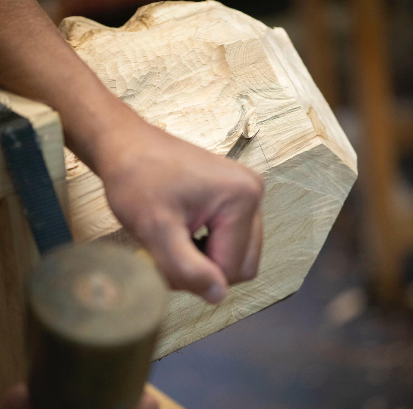 Student of Jamie Frost carving wood.